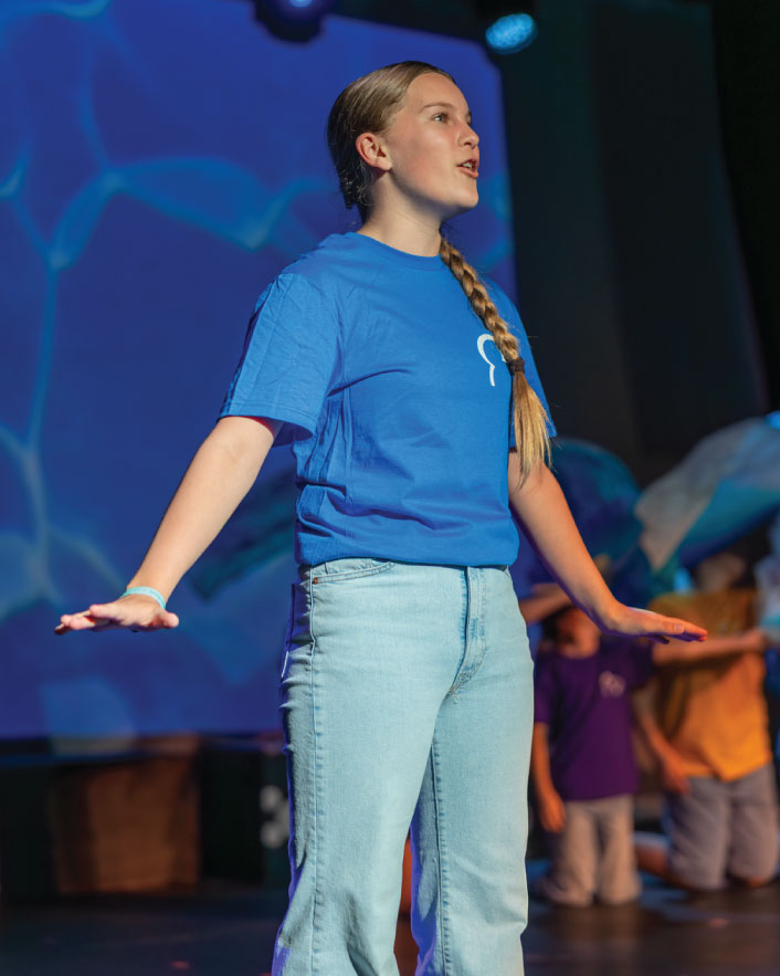 Actress on stage singing at Centerstage